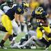 Michigan running back Fitzgerald Toussaint looks to run the ball past Michigan defense during the third quarter against Michigan State at Michigan Stadium on Saturday afternoon. Melanie Maxwell I AnnArbor.com